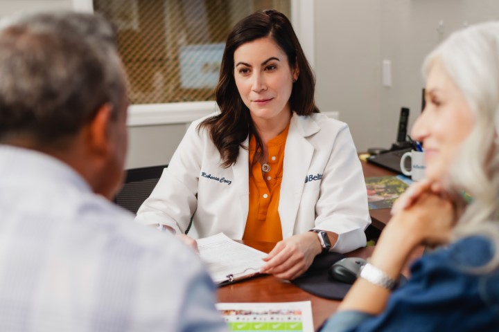 audiologist meeting with hearing loss patient